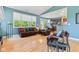 Cozy living room featuring hardwood floors, comfortable leather furniture, and natural light at 11510 Monon Farms Ln, Carmel, IN 46032