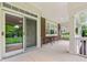A covered patio with brick accents and sliding glass doors offers an inviting outdoor space at 11510 Monon Farms Ln, Carmel, IN 46032