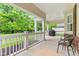 Lovely covered porch with grill, white railing, and inviting outdoor space at 11510 Monon Farms Ln, Carmel, IN 46032