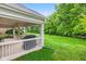 Inviting outdoor porch with beautiful landscaping and a relaxing grill area at 11510 Monon Farms Ln, Carmel, IN 46032