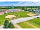 An aerial view showcasing the baseball fields, water tower, and some residential properties in the surrounding community at 1240 Stringtown Pike, Cicero, IN 46034