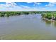 Expansive aerial shot of the lake, community, and tree-lined waterfront properties at 1240 Stringtown Pike, Cicero, IN 46034