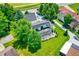 Private backyard featuring mature trees, a screened porch and lush landscaping at 1240 Stringtown Pike, Cicero, IN 46034