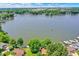 Scenic aerial view of lakefront properties, with vibrant trees along the shoreline at 1240 Stringtown Pike, Cicero, IN 46034