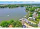 Breathtaking aerial view of lakefront homes, a lush shoreline, and docks at 1240 Stringtown Pike, Cicero, IN 46034