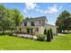 Spacious backyard featuring a covered patio, perfect for outdoor entertaining and relaxation at 1240 Stringtown Pike, Cicero, IN 46034