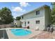 Inviting backyard with a refreshing in-ground pool, surrounded by lawn, perfect for warm days at 1240 Stringtown Pike, Cicero, IN 46034