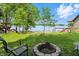 Beautiful backyard features lake views, a fire pit, comfortable seating, a flourishing ecosystem, and is perfect for relaxation at 1240 Stringtown Pike, Cicero, IN 46034
