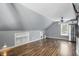 Bright bonus room features wood floors, stainless steel appliances, storage, and natural light at 1240 Stringtown Pike, Cicero, IN 46034