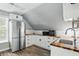 Well-equipped kitchen features stainless steel appliances, wood countertop, and sleek white cabinets at 1240 Stringtown Pike, Cicero, IN 46034