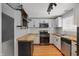 Modern kitchen with white cabinets, butcher block countertops, and stainless steel appliances at 1240 Stringtown Pike, Cicero, IN 46034