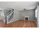 Spacious living room featuring a modern fireplace, wood floors, and a bright window at 1240 Stringtown Pike, Cicero, IN 46034