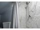Shower with marble tiles, a rainfall shower head, and modern fixtures at 1240 Stringtown Pike, Cicero, IN 46034
