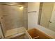 A bathroom features a glass-enclosed shower, vanity, and mirror; modern and functional design at 12403 Fresh Stock Dr, Noblesville, IN 46060