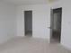 Simple bedroom with an open door, a closet, and ample space at 12403 Fresh Stock Dr, Noblesville, IN 46060