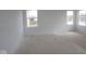This spacious bedroom offers ample natural light with windows providing serene outdoor views at 12403 Fresh Stock Dr, Noblesville, IN 46060