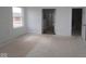 Unfinished bedroom featuring two doorways, and a window at 12403 Fresh Stock Dr, Noblesville, IN 46060