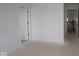 Spacious unfinished bedroom with an open door and a closet at 12403 Fresh Stock Dr, Noblesville, IN 46060