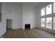 Bright living room with a fireplace, high ceilings, and lots of natural light at 12403 Fresh Stock Dr, Noblesville, IN 46060