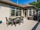 Spacious backyard deck offering outdoor seating with picturesque views of the home and surrounding trees at 13069 Abraham Run, Carmel, IN 46033