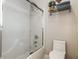 Neat bathroom highlighting modern fixtures, white toilet, shower over tub and tiled walls at 13069 Abraham Run, Carmel, IN 46033