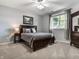 Cozy bedroom featuring a queen size bed, carpet flooring, neutral paint, and ample closet space at 13069 Abraham Run, Carmel, IN 46033