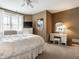 Inviting bedroom with large window, white bedding, neutral carpet, and stylish decor at 13069 Abraham Run, Carmel, IN 46033