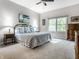 Inviting bedroom featuring soft lighting, blue accents, and natural light at 13069 Abraham Run, Carmel, IN 46033