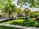Charming brick home with manicured lawn, mature trees, and welcoming entryway, perfect for suburban living at 13069 Abraham Run, Carmel, IN 46033