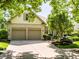 Beautiful brick home featuring a spacious driveway and an attached garage, showcasing curb appeal at 13069 Abraham Run, Carmel, IN 46033