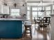 Open kitchen with a breakfast bar, stainless steel appliances, and a cozy dining area with lots of light at 13069 Abraham Run, Carmel, IN 46033