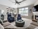 Bright living room with a fireplace, plush seating, and an open layout, ideal for relaxation at 13069 Abraham Run, Carmel, IN 46033