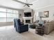 Cozy living room with a fireplace, a large window, and comfortable seating perfect for Gathering time at 13069 Abraham Run, Carmel, IN 46033