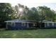 Charming blue home featuring a well-maintained front yard, mature tree and beautiful landscaping at 1309 Rolling Ct, Westfield, IN 46074