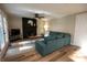 Spacious living room with fireplace, ceiling fan, and access to the backyard at 1309 Rolling Ct, Westfield, IN 46074