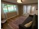 Bright living room featuring wood floors, neutral walls, a large window, and comfortable seating at 1309 Rolling Ct, Westfield, IN 46074