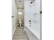 Clean bathroom featuring a tub and shower combination, a window, and modern fixtures at 1325 Northcrest Dr, Anderson, IN 46012