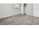 Neutral bedroom featuring plush carpeting, neutral walls, a window, and closet with sliding doors at 1325 Northcrest Dr, Anderson, IN 46012