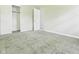 Neutral bedroom featuring plush carpeting, neutral walls, and closet with white doors at 1325 Northcrest Dr, Anderson, IN 46012