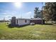 Back of the home featuring white vinyl siding, brick accents, and a well-maintained lawn at 13518 (3 Lots) Promise Rd, Fishers, IN 46038