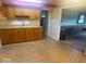 A kitchen features wood cabinets, linoleum floor and access to the bonus room at 13518 (3 Lots) Promise Rd, Fishers, IN 46038
