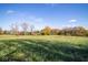 Extensive open yard, ideal for any outdoor plans, under a backdrop of beautiful blue sky at 13518 (3 Lots) Promise Rd, Fishers, IN 46038