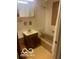 Bathroom with a single sink vanity and a bath tub with shower curtain and beige tile at 13518 Promise Rd, Fishers, IN 46038