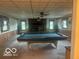 Recreation room with pool table, fireplace and bead board at 13518 Promise Rd, Fishers, IN 46038