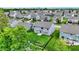 Backyard aerial view showing a well-maintained lawn, garden area, and outdoor patio with furniture at 1384 Horse Shoe, Greenwood, IN 46143