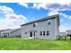 Exterior backyard featuring a gray sided home with a well-maintained lawn and black metal fencing at 1384 Horse Shoe, Greenwood, IN 46143