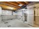 Unfinished basement with utility infrastructure showing water heater, HVAC, and electrical box at 1384 Horse Shoe, Greenwood, IN 46143