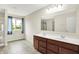 The bathroom features a double sink vanity and a glass enclosed shower at 1384 Horse Shoe, Greenwood, IN 46143