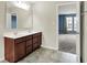 This bathroom has a double sink vanity with dark wood cabinets and an adjacent bedroom at 1384 Horse Shoe, Greenwood, IN 46143