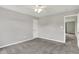 The bedroom features neutral gray walls and gray carpeting with adjacent rooms nearby at 1384 Horse Shoe, Greenwood, IN 46143